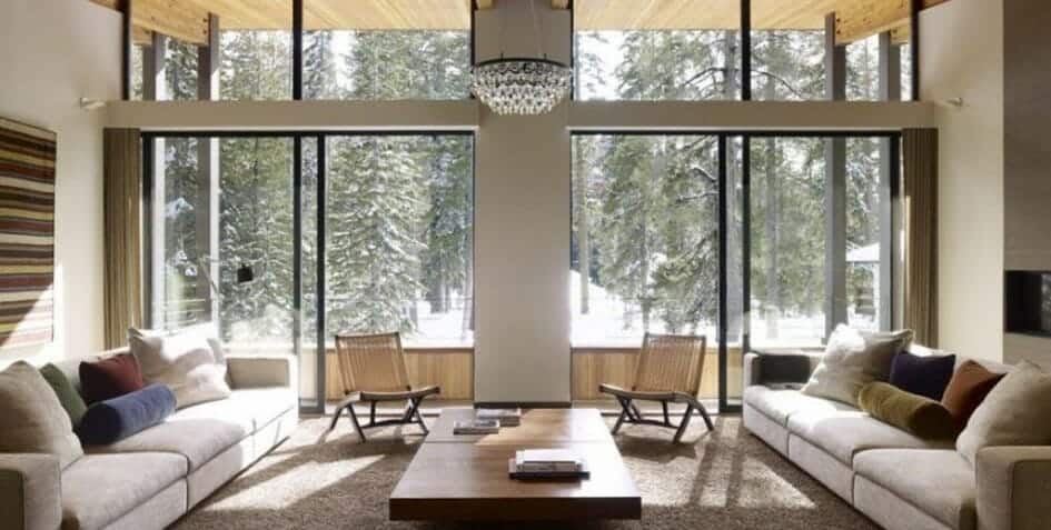 An image of a cozy living room with snow outside
